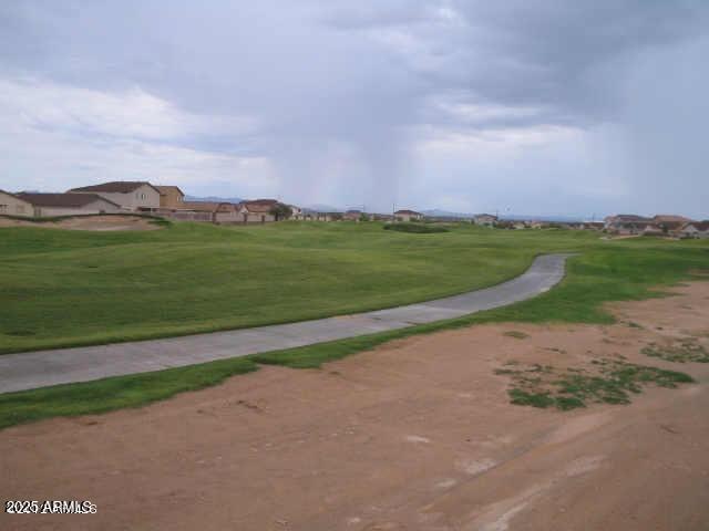 view of property's community featuring a yard