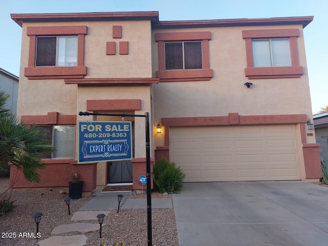 5708 E Sunrise Cir, Florence, AZ 85132 - view of front of house with an attached garage, concrete driveway, and stucco siding