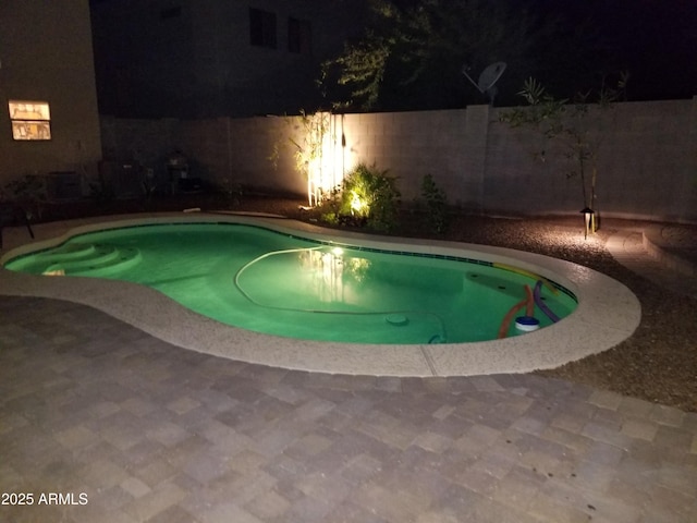 5708 E Sunrise Cir, Florence, AZ 85132 - pool at twilight featuring fence, a fenced in pool, and a patio area