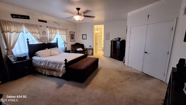 5708 E Sunrise Cir, Florence, AZ 85132 - bedroom featuring connected bathroom, ceiling fan, and light carpet