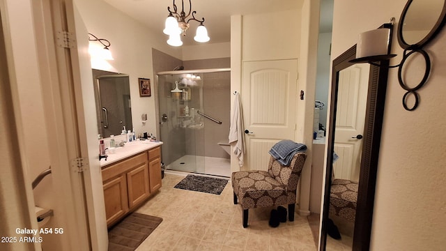 5708 E Sunrise Cir, Florence, AZ 85132 - bathroom with tile patterned flooring, a shower stall, vanity, and a chandelier