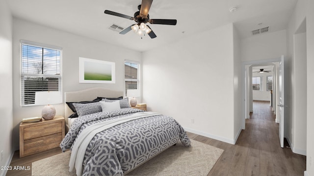 bedroom featuring hardwood / wood-style flooring and ceiling fan