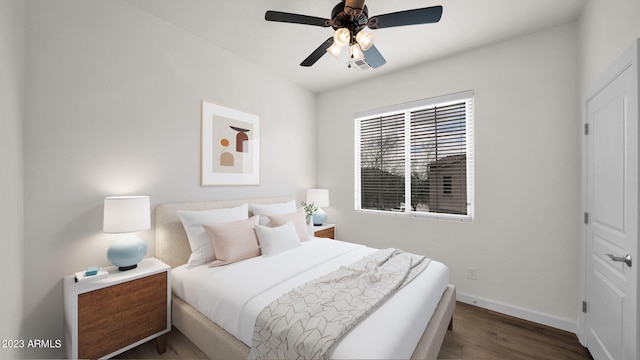 bedroom with ceiling fan and hardwood / wood-style floors