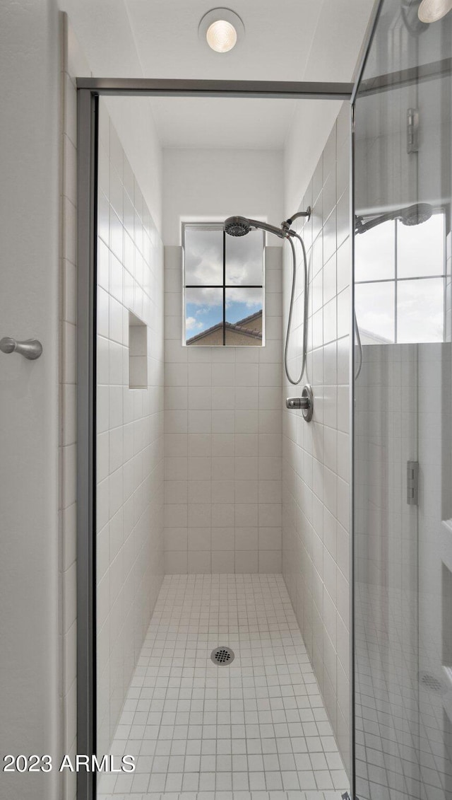 full bathroom featuring a stall shower