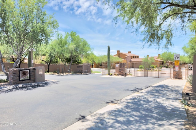 view of yard with fence and a gate