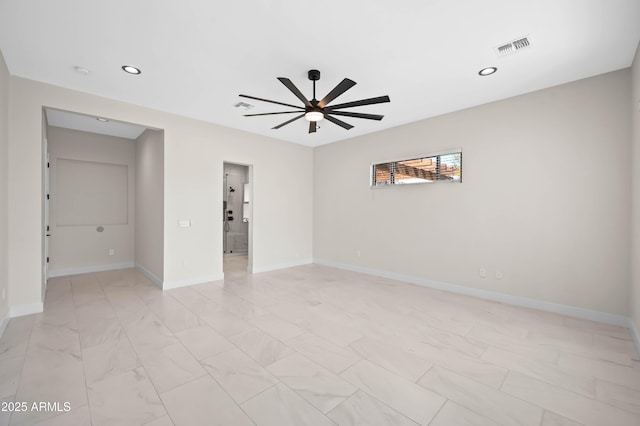 spare room with a ceiling fan, baseboards, visible vents, and marble finish floor