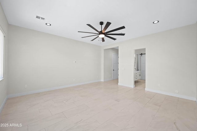 spare room featuring recessed lighting, a ceiling fan, visible vents, and baseboards