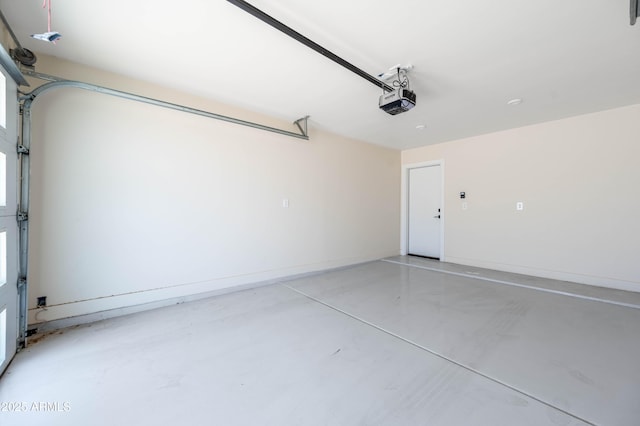 garage featuring baseboards and a garage door opener