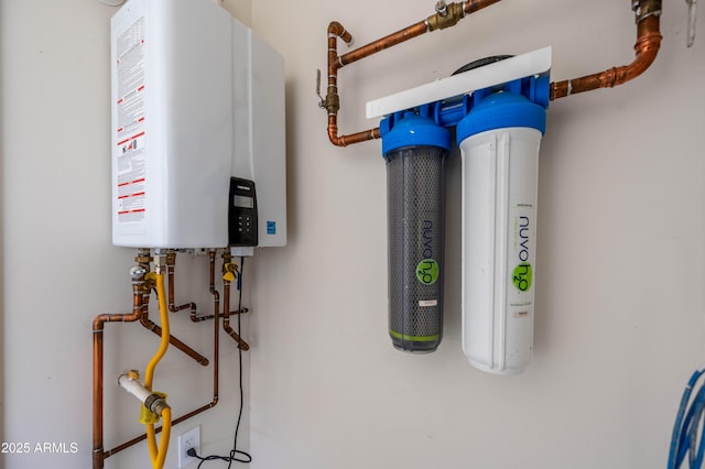 utility room featuring water heater