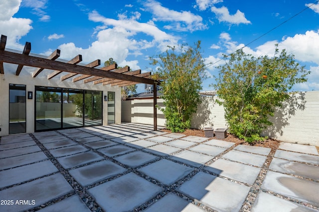 view of patio / terrace featuring a pergola and a fenced backyard