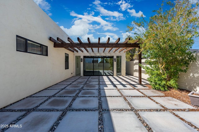 view of patio / terrace with a pergola and fence