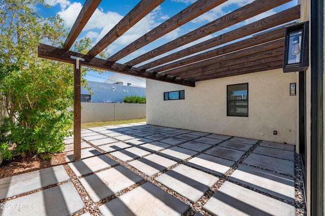 view of patio / terrace featuring fence and a pergola