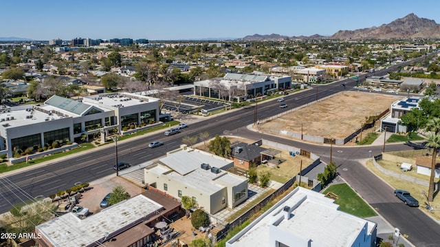 birds eye view of property featuring a mountain view