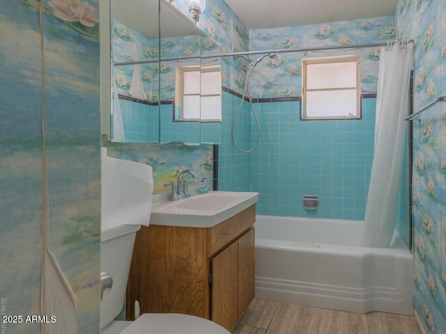 full bathroom with shower / tub combo, toilet, plenty of natural light, and wood-type flooring