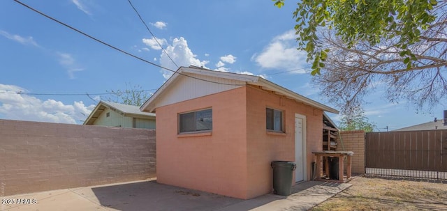 view of side of home with a patio