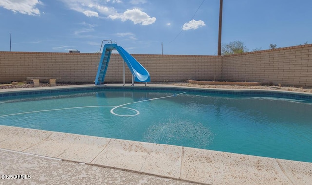 view of pool featuring a water slide