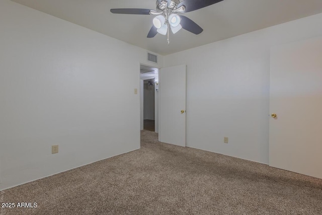 empty room with carpet and ceiling fan