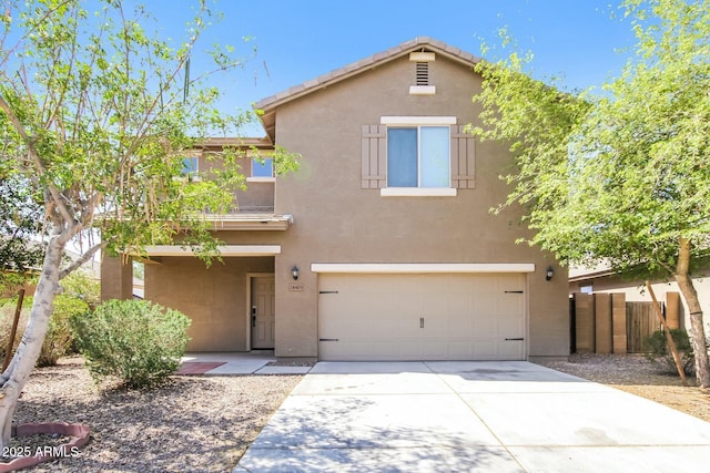 24479 W Mobile Ln, Buckeye, AZ 85326 - traditional home with stucco siding, an attached garage, fence, and driveway