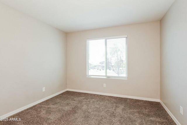 24479 W Mobile Ln, Buckeye, AZ 85326 - spare room featuring baseboards and carpet flooring