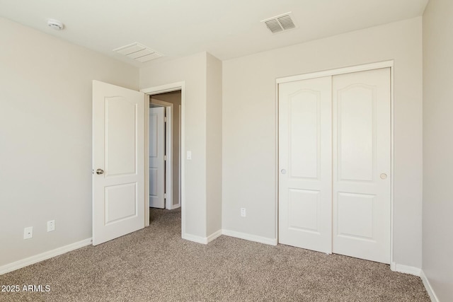 24479 W Mobile Ln, Buckeye, AZ 85326 - unfurnished bedroom with a closet, carpet floors, visible vents, and baseboards