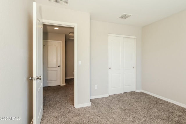 24479 W Mobile Ln, Buckeye, AZ 85326 - unfurnished bedroom with light carpet, baseboards, visible vents, and a closet