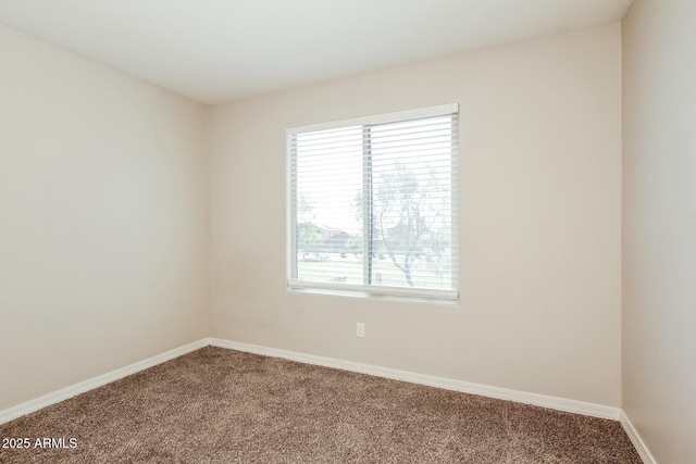 24479 W Mobile Ln, Buckeye, AZ 85326 - carpeted empty room with baseboards