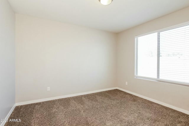 24479 W Mobile Ln, Buckeye, AZ 85326 - empty room with baseboards and carpet floors