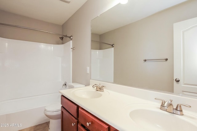 24479 W Mobile Ln, Buckeye, AZ 85326 - bathroom with tile patterned flooring, double vanity, toilet, and a sink