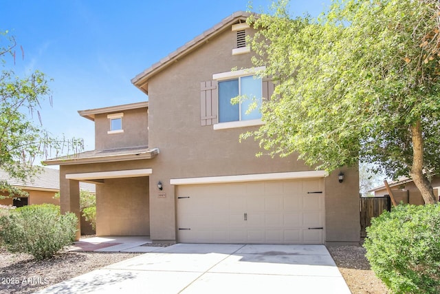 24479 W Mobile Ln, Buckeye, AZ 85326 - traditional home with a garage, concrete driveway, fence, and stucco siding