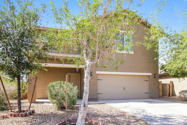 24479 W Mobile Ln, Buckeye, AZ 85326 - view of front of house featuring an attached garage, stucco siding, and driveway