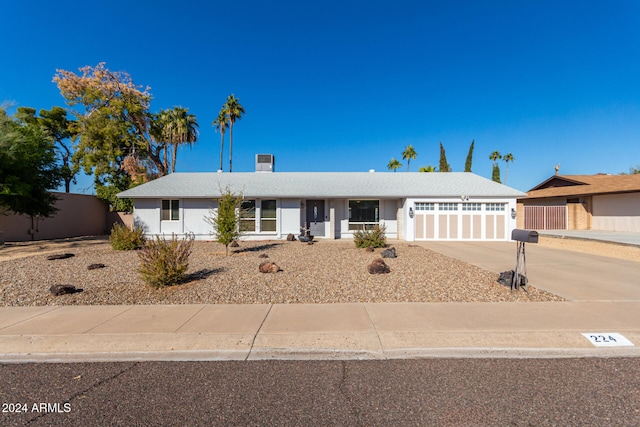 ranch-style home featuring a garage