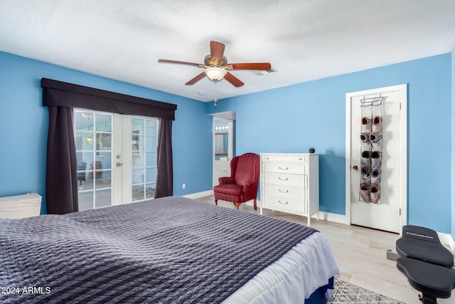 bedroom with ceiling fan, french doors, and light wood-type flooring