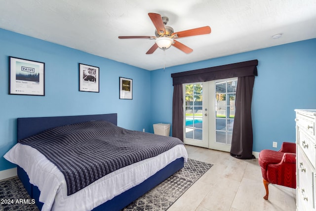 bedroom with access to exterior, ceiling fan, french doors, and light hardwood / wood-style flooring