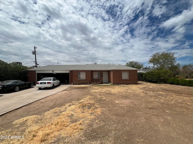 ranch-style home featuring a garage