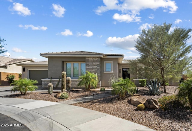 2821 E Cashman Dr, Phoenix, AZ 85050 - prairie-style house featuring stone siding, an attached garage, stucco siding, and concrete driveway
