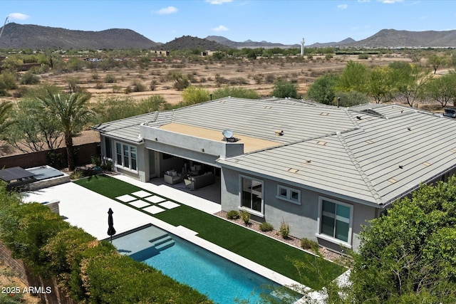 2821 E Cashman Dr, Phoenix, AZ 85050 - rear view of property with a patio, a mountain view, an outdoor hangout area, stucco siding, and an outdoor pool