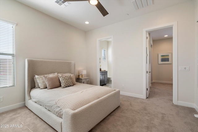 2821 E Cashman Dr, Phoenix, AZ 85050 - bedroom featuring light colored carpet, baseboards, ensuite bath, and recessed lighting