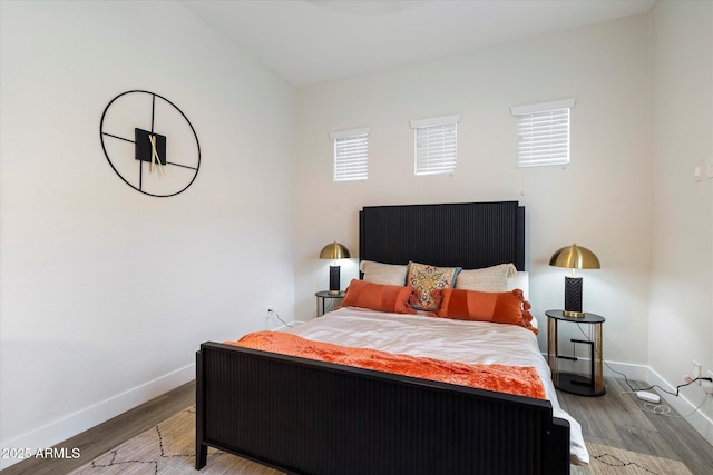 2821 E Cashman Dr, Phoenix, AZ 85050 - bedroom with baseboards and wood finished floors