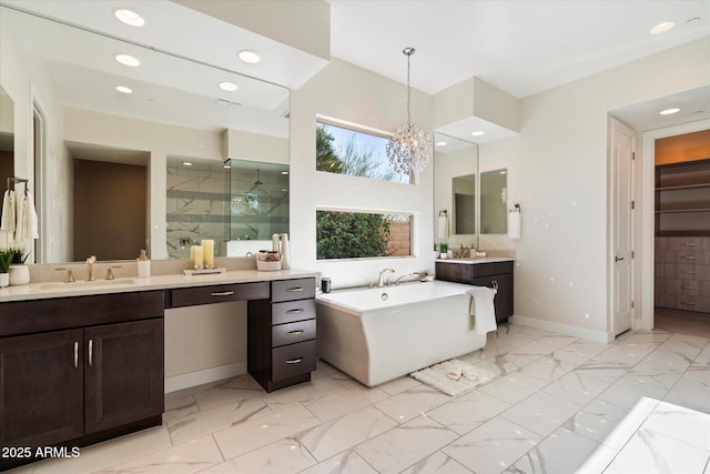 2821 E Cashman Dr, Phoenix, AZ 85050 - full bath with a stall shower, marble finish flooring, a freestanding bath, two vanities, and recessed lighting
