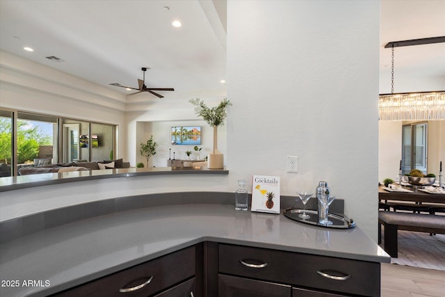 2821 E Cashman Dr, Phoenix, AZ 85050 - kitchen featuring ceiling fan, open floor plan, recessed lighting, wood finished floors, and a chandelier