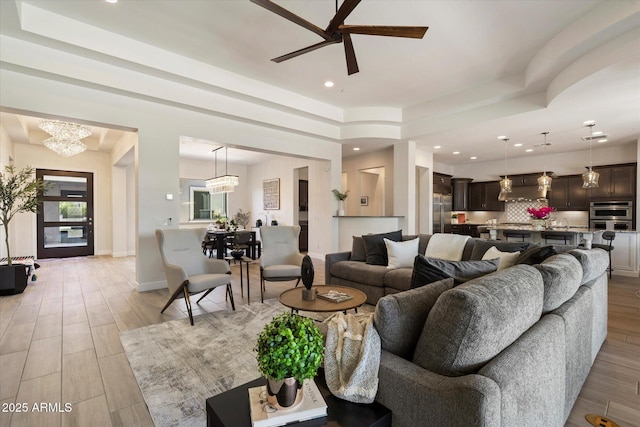2821 E Cashman Dr, Phoenix, AZ 85050 - living room with a chandelier, a ceiling fan, recessed lighting, light wood-type flooring, and baseboards
