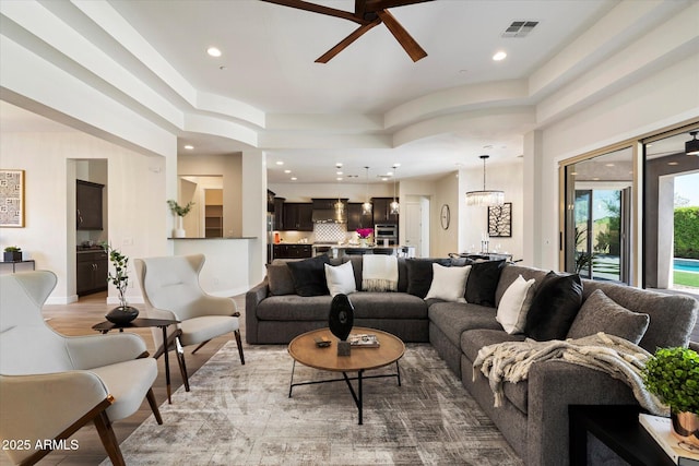 2821 E Cashman Dr, Phoenix, AZ 85050 - living room with ceiling fan, recessed lighting, a raised ceiling, and wood finished floors