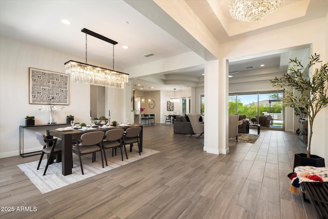 2821 E Cashman Dr, Phoenix, AZ 85050 - dining space featuring a chandelier, wood finished floors, recessed lighting, and baseboards