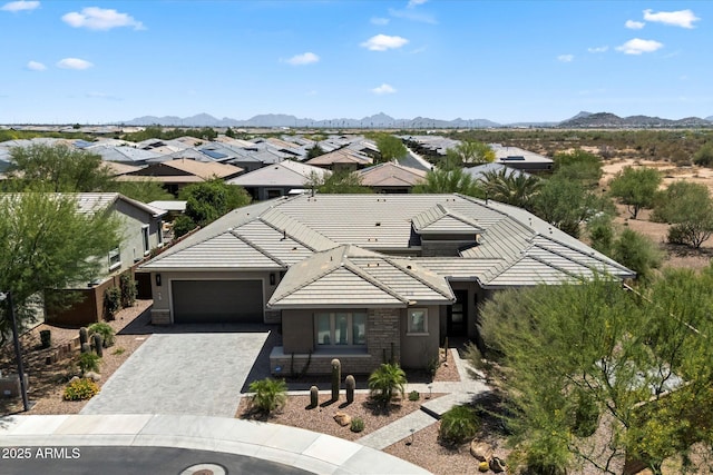 2821 E Cashman Dr, Phoenix, AZ 85050 - view of front of property featuring a tiled roof, an attached garage, decorative driveway, and a mountain view