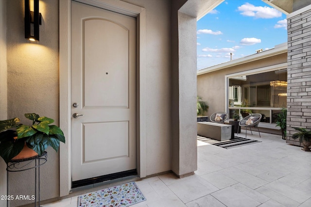 2821 E Cashman Dr, Phoenix, AZ 85050 - entrance to property with a patio and stucco siding