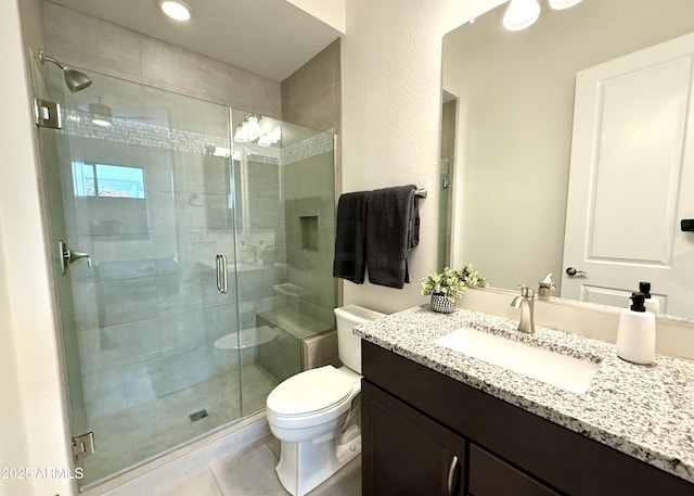 2821 E Cashman Dr, Phoenix, AZ 85050 - full bathroom featuring toilet, tile patterned flooring, a stall shower, and vanity