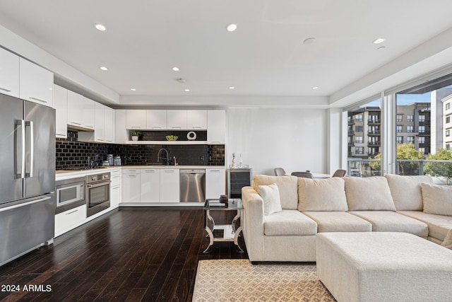 living room featuring light hardwood / wood-style flooring and sink