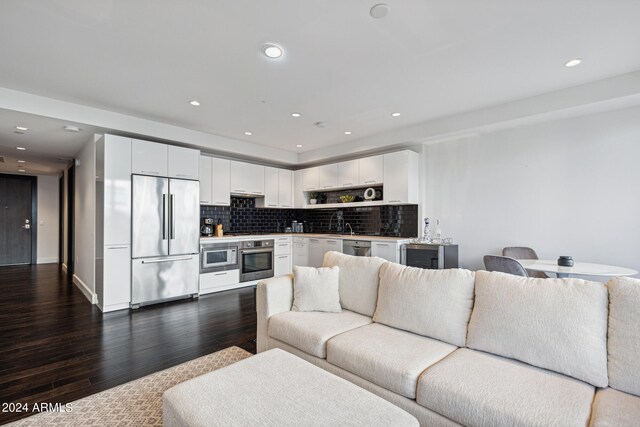 living room featuring dark wood-type flooring