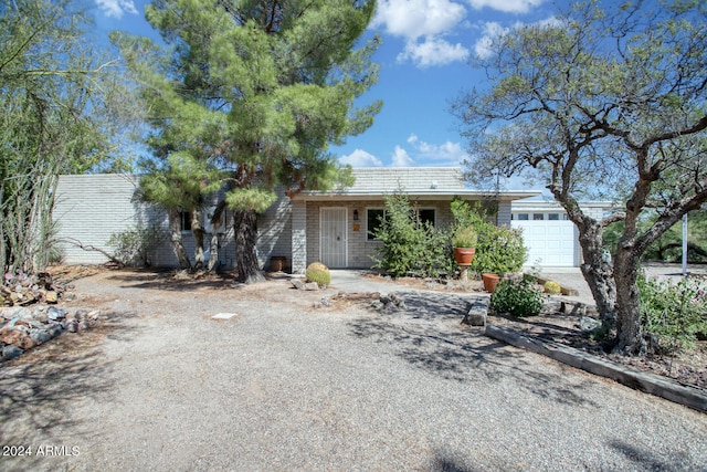 ranch-style home featuring a garage