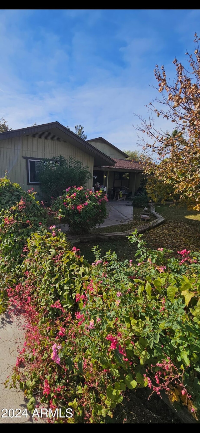 view of side of home featuring a patio